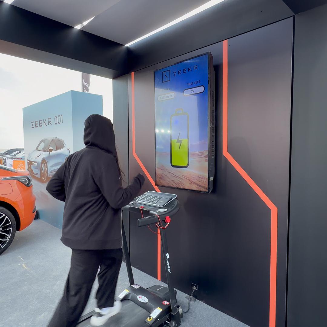 Interactive Treadmill Activation in Dubai: Participants generating human power to recharge EV cars
